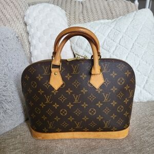 Authentic Louis Vuitton Monogram Alma PM Hand Bag..